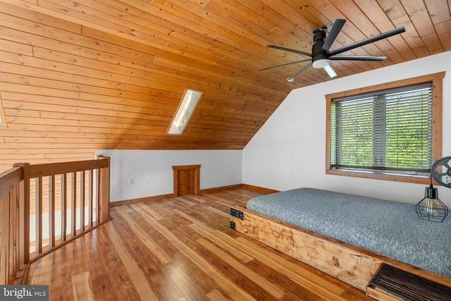 2107 Lenape Ter, Canadensis, PA 18325 - unfurnished bedroom with wooden ceiling, a skylight, lofted ceiling, hardwood / wood-style floors, and baseboards
