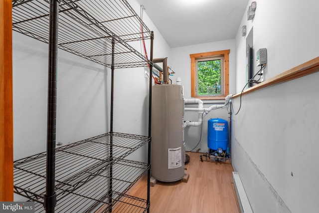 2107 Lenape Ter, Canadensis, PA 18325 - utility room with water heater and a baseboard radiator