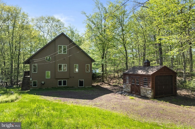 2107 Lenape Ter, Canadensis, PA 18325 - view of side of property featuring an outbuilding, a garage, and stairs
