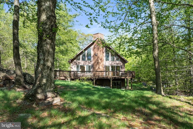 2107 Lenape Ter, Canadensis, PA 18325 - rear view of house with a wooden deck and a chimney