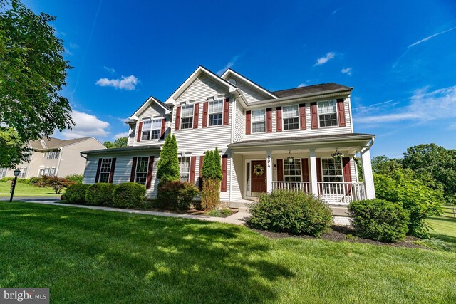 294 Arthur Ave, Port Deposit, MD 21904 - view of front facade with a porch and a front yard