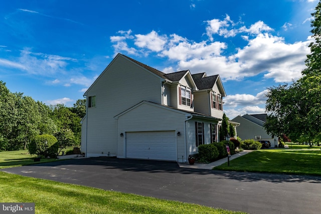 294 Arthur Ave, Port Deposit, MD 21904 - view of side of home featuring a garage, a lawn, and driveway