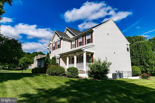 294 Arthur Ave, Port Deposit, MD 21904 - view of home's exterior with covered porch, a lawn, and central AC