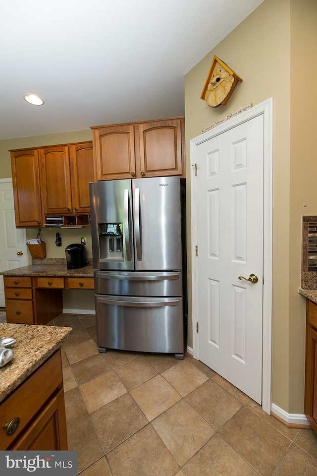 294 Arthur Ave, Port Deposit, MD 21904 - kitchen with stainless steel fridge, brown cabinets, light stone countertops, baseboards, and recessed lighting