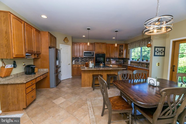 294 Arthur Ave, Port Deposit, MD 21904 - kitchen with stainless steel appliances, a center island, decorative backsplash, brown cabinetry, and recessed lighting