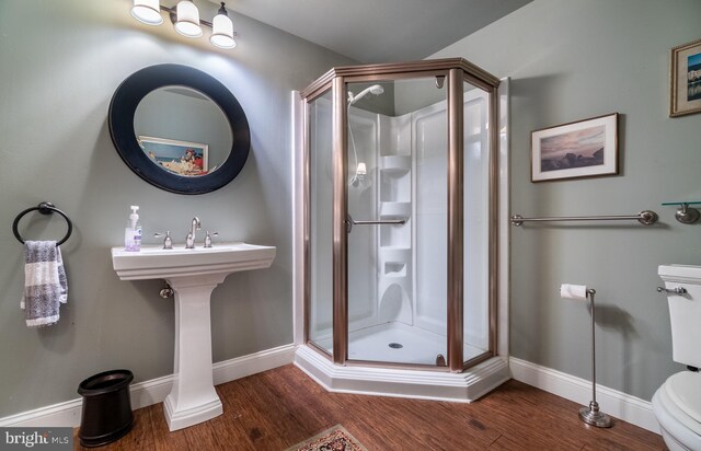 318 Ironstone Ln, Elverson, PA 19520 - bathroom featuring a shower stall, toilet, wood finished floors, and baseboards