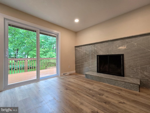 585 Andrew Dr, Southampton, PA 18966 - unfurnished living room featuring wood finished floors, baseboards, a high end fireplace, and recessed lighting