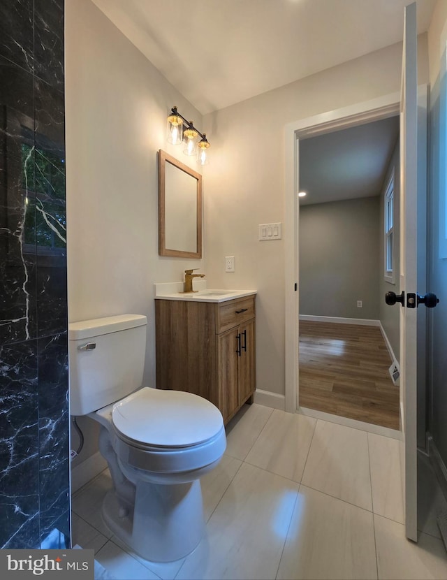 585 Andrew Dr, Southampton, PA 18966 - bathroom featuring vanity, baseboards, tile patterned flooring, and toilet