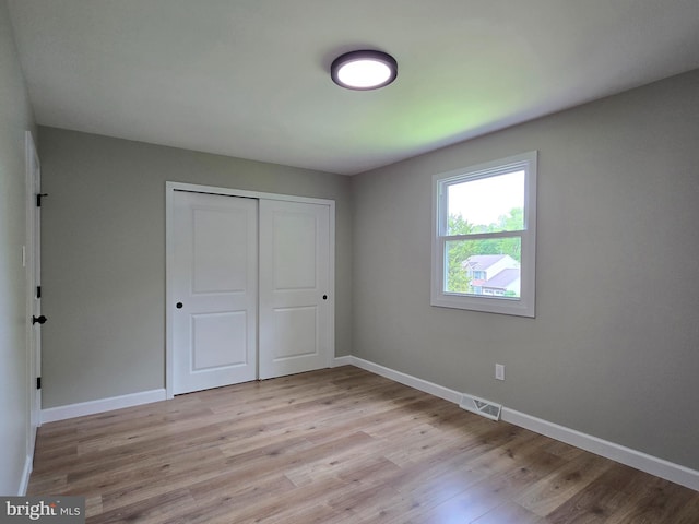 585 Andrew Dr, Southampton, PA 18966 - unfurnished bedroom with baseboards, a closet, and light wood-type flooring