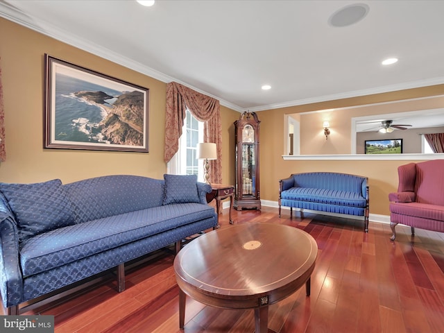 living area with hardwood / wood-style flooring, ornamental molding, baseboards, ceiling fan, and recessed lighting