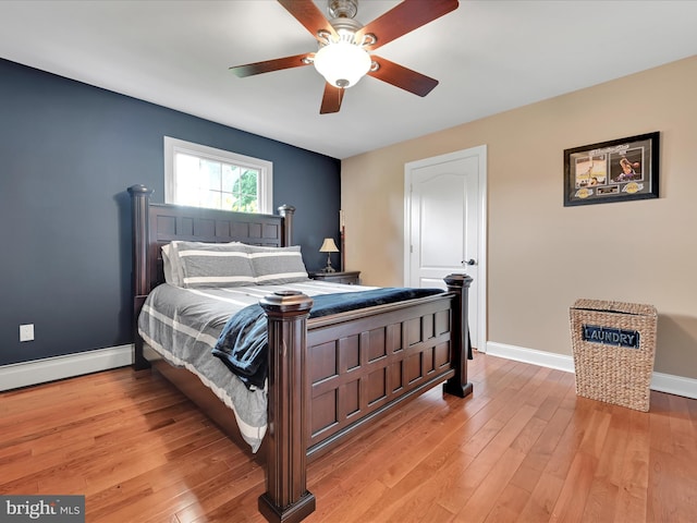 bedroom featuring baseboards, light wood-type flooring, and a ceiling fan