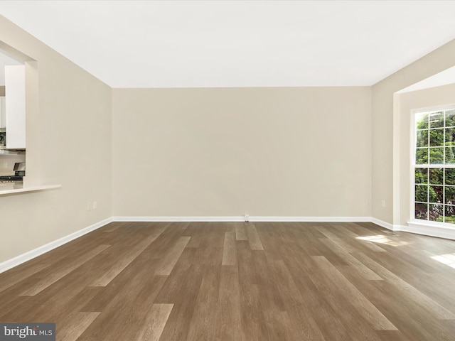 5534 Upshur, Frederick, MD 21703 - unfurnished living room with wood finished floors and baseboards