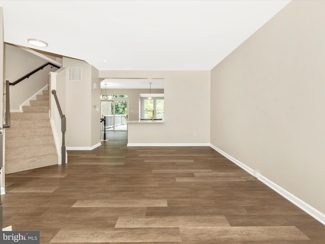 5534 Upshur, Frederick, MD 21703 - spare room with stairs, baseboards, wood finished floors, and a chandelier