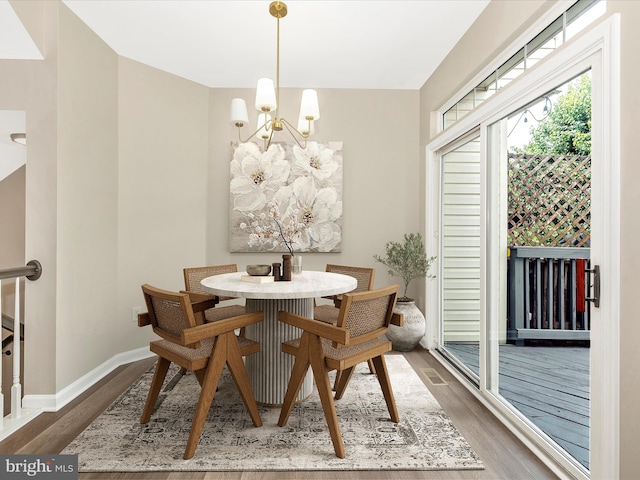 5534 Upshur, Frederick, MD 21703 - dining area with a chandelier, wood finished floors, and baseboards