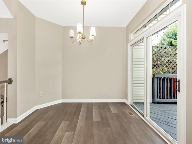 5534 Upshur, Frederick, MD 21703 - spare room featuring wood finished floors, a chandelier, and baseboards