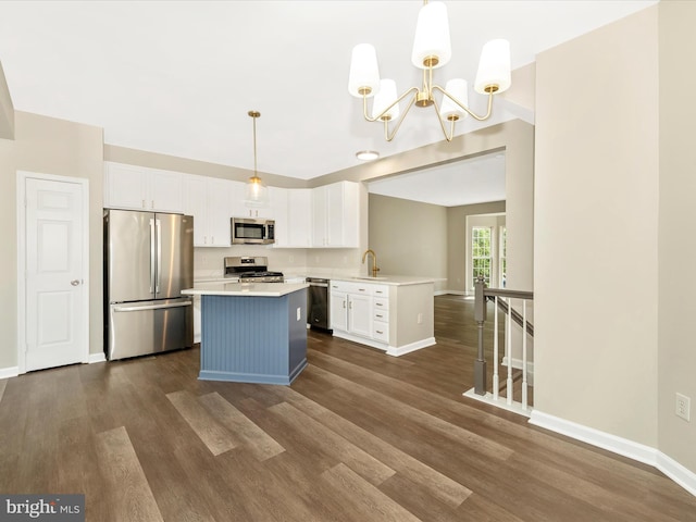 5534 Upshur, Frederick, MD 21703 - kitchen with stainless steel appliances, dark wood-type flooring, white cabinetry, light countertops, and a chandelier