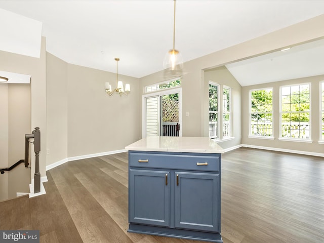 5534 Upshur, Frederick, MD 21703 - kitchen featuring dark wood-style flooring, a chandelier, blue cabinetry, light countertops, and baseboards