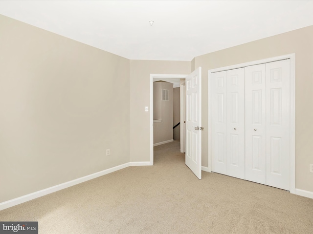 5534 Upshur, Frederick, MD 21703 - unfurnished bedroom featuring light colored carpet, baseboards, and a closet