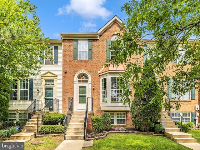 5534 Upshur, Frederick, MD 21703 - townhome / multi-family property with brick siding and a front lawn