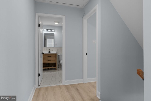 6305 Powder Horn Ct, Bensalem, PA 19020 - hallway featuring wood finished floors and a sink