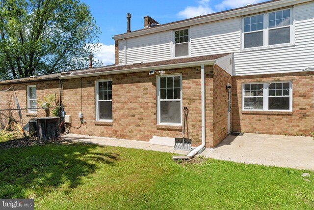 6305 Powder Horn Ct, Bensalem, PA 19020 - rear view of property featuring cooling unit and brick siding