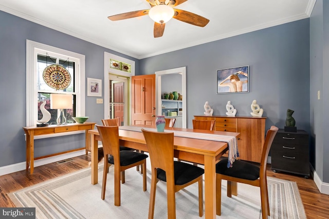 213 N Queen St, Chestertown, MD 21620 - dining area featuring wood finished floors, ceiling fan, crown molding, and baseboards