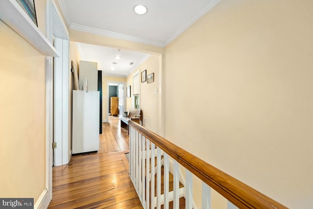 213 N Queen St, Chestertown, MD 21620 - corridor with light wood finished floors, ornamental molding, an upstairs landing, and recessed lighting