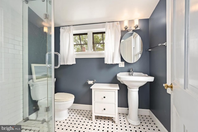 213 N Queen St, Chestertown, MD 21620 - full bathroom with a shower stall, toilet, baseboards, and tile patterned floors