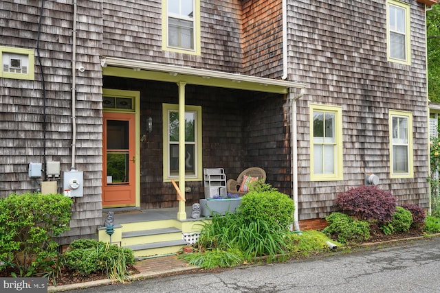 213 N Queen St, Chestertown, MD 21620 - doorway to property featuring covered porch