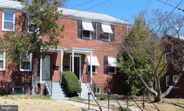 view of property with brick siding