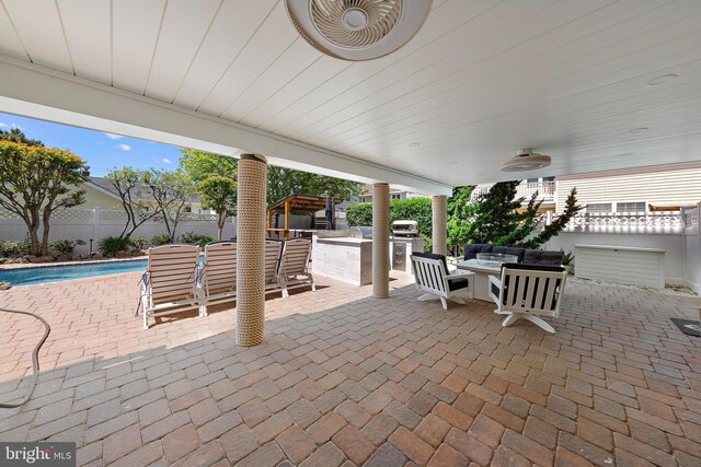 38 N 10th St, Surf City, NJ 08008 - fenced backyard featuring area for grilling, a patio area, and an outdoor hangout area