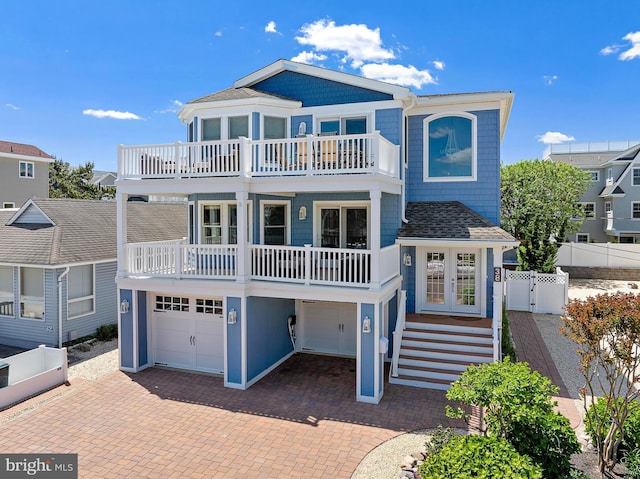 38 N 10th St, Surf City, NJ 08008 - beach home featuring a balcony, an attached garage, french doors, a gate, and decorative driveway