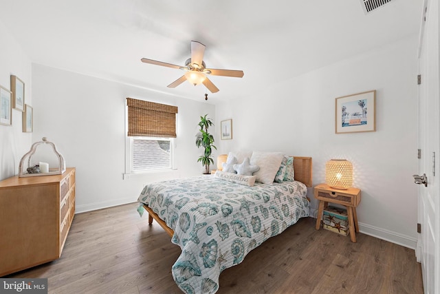 38 N 10th St, Surf City, NJ 08008 - bedroom featuring baseboards, wood finished floors, and a ceiling fan