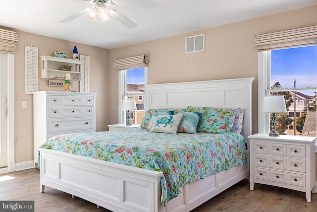 38 N 10th St, Surf City, NJ 08008 - bedroom with wood finished floors, a ceiling fan, and baseboards