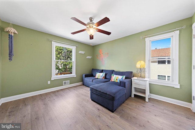 38 N 10th St, Surf City, NJ 08008 - living area with a ceiling fan, baseboards, and wood finished floors