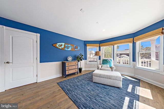 38 N 10th St, Surf City, NJ 08008 - living area featuring wood finished floors, wainscoting, and baseboards