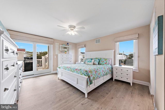 38 N 10th St, Surf City, NJ 08008 - bedroom featuring access to exterior, multiple windows, and light wood finished floors