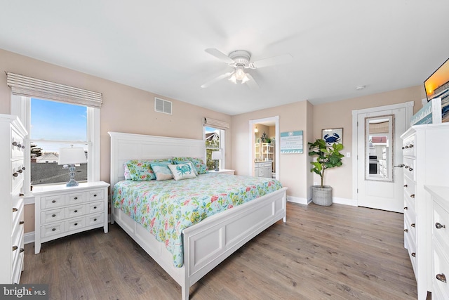 38 N 10th St, Surf City, NJ 08008 - bedroom featuring dark wood-style floors, baseboards, ceiling fan, and ensuite bathroom