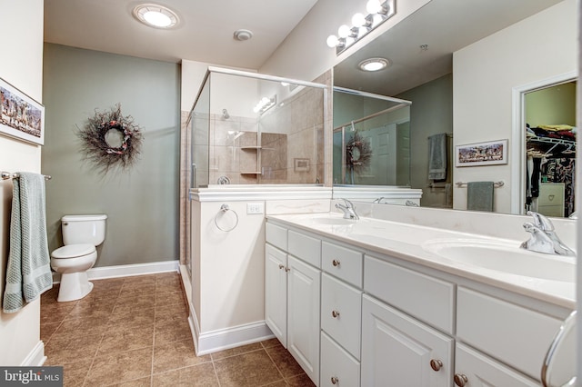 137 Settlers Way, Boalsburg, PA 16827 - full bathroom featuring double vanity, a stall shower, a walk in closet, and tile patterned flooring