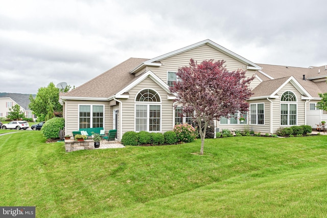 137 Settlers Way, Boalsburg, PA 16827 - back of property featuring a patio area, a lawn, and roof with shingles