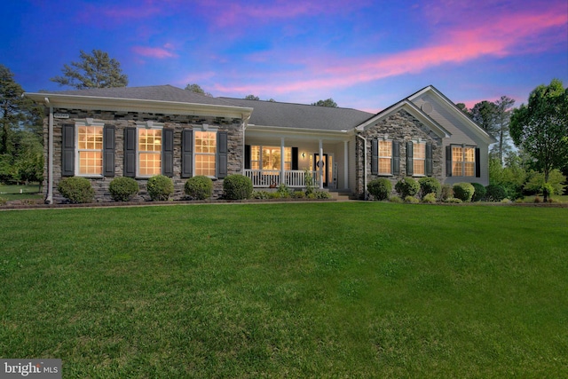 26248 Tranquility View Ct, Mechanicsville, MD 20659 - view of front facade with stone siding, a porch, and a front yard