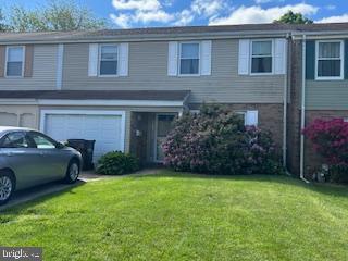 6317 Congress Ct, Bensalem, PA 19020 - view of front facade featuring a front yard and an attached garage