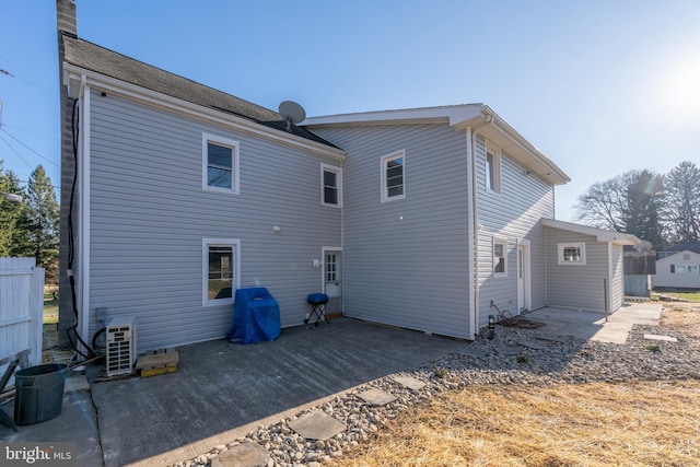 back of property featuring a patio and ac unit