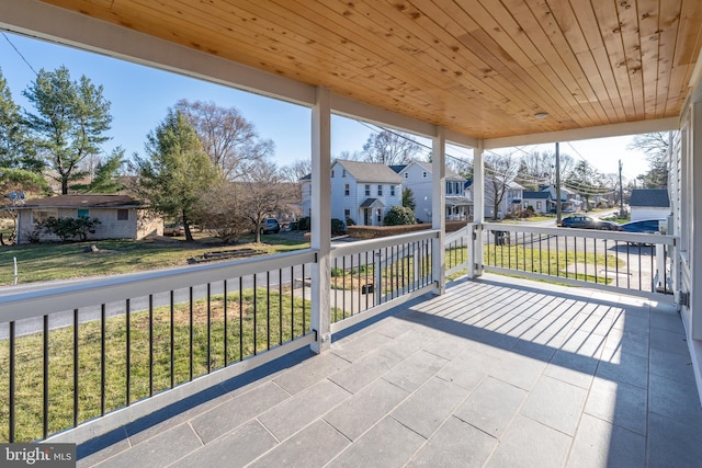 unfurnished sunroom featuring a residential view and plenty of natural light