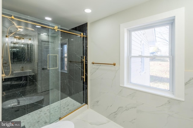 full bathroom featuring recessed lighting, a marble finish shower, and marble finish floors