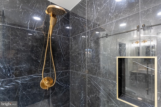 bathroom view of tiled shower