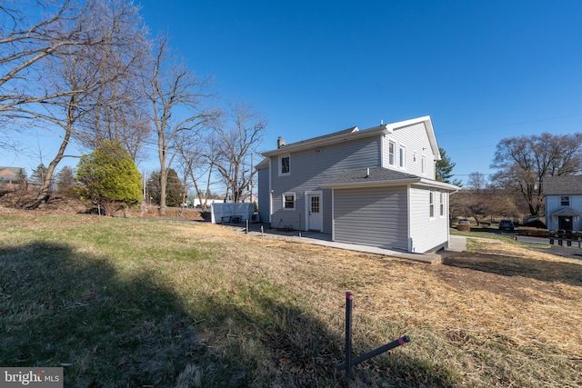 back of property with a chimney