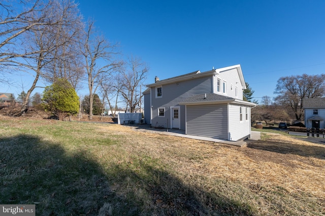 rear view of house featuring a chimney