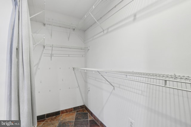 1147 N 4th St Unit 2E, Philadelphia, PA 19123 - spacious closet featuring stone tile flooring