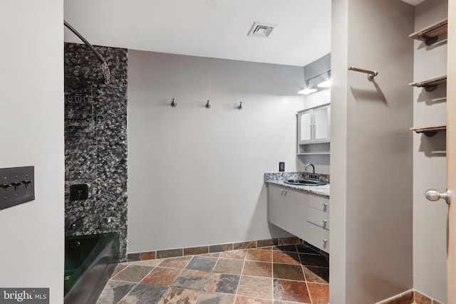 1147 N 4th St Unit 2E, Philadelphia, PA 19123 - full bathroom featuring stone tile flooring, vanity, and bathing tub / shower combination